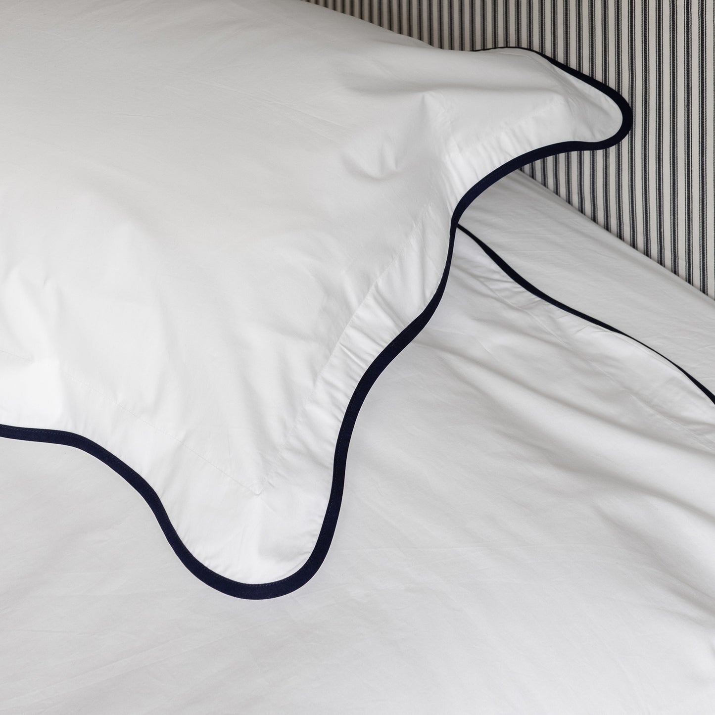 close up of navy wave border bed linen set