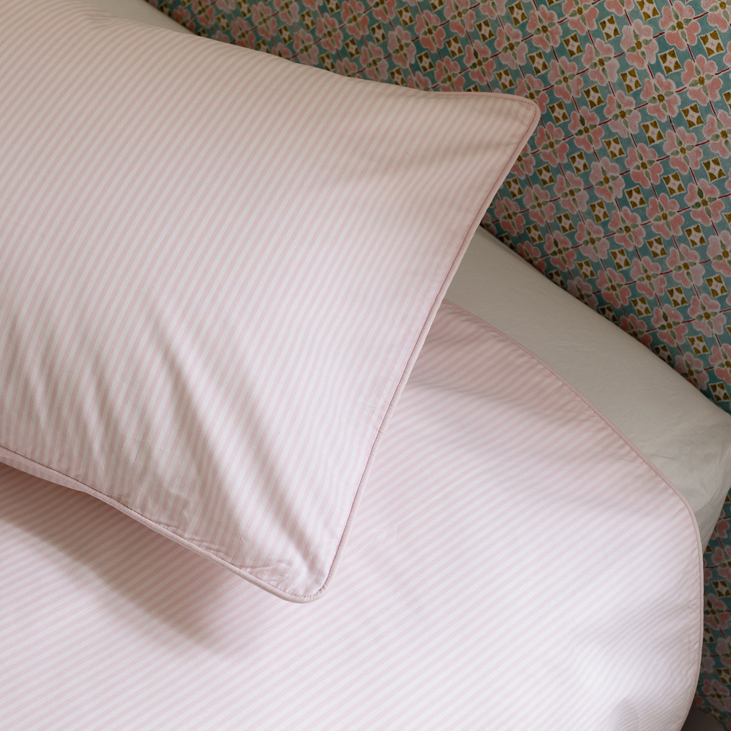 close up of pink and white stripe kids bed linen