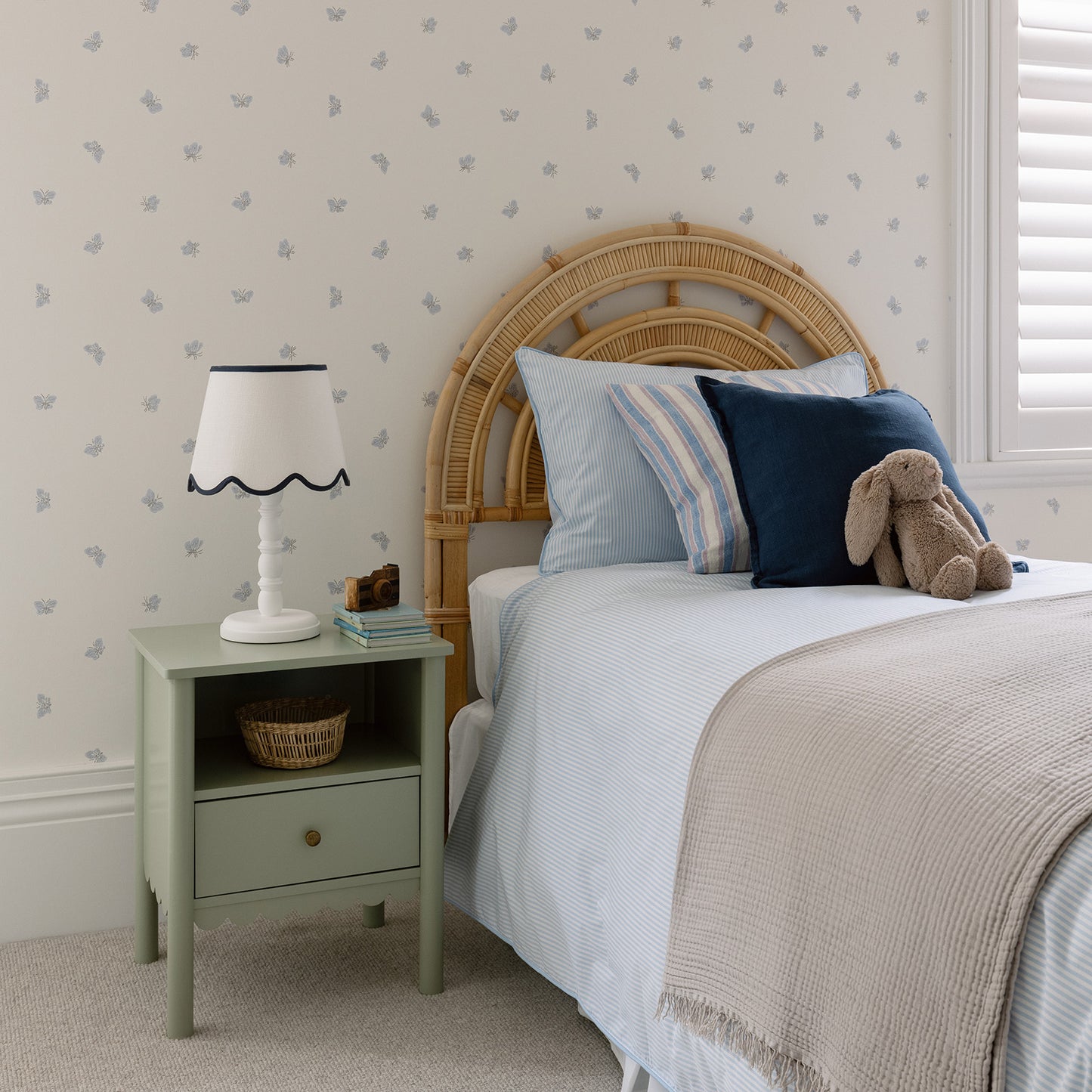 side view stylish boys room blue and white stripe bed linen