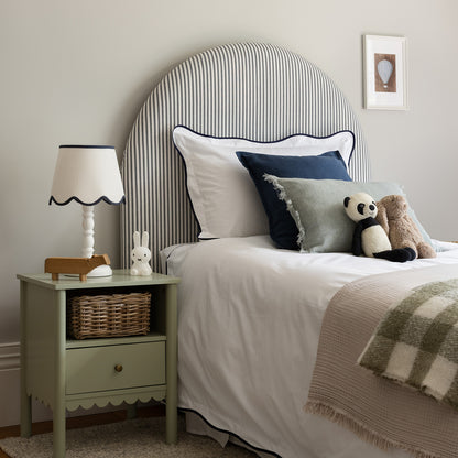 side view of stylish bedroom using navy wave border bed linen