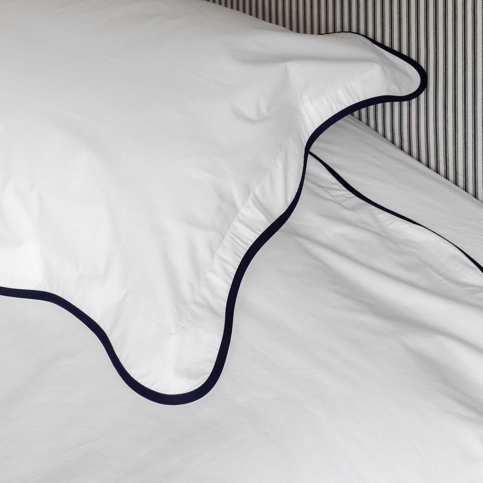 close up of navy wave border bed linen set